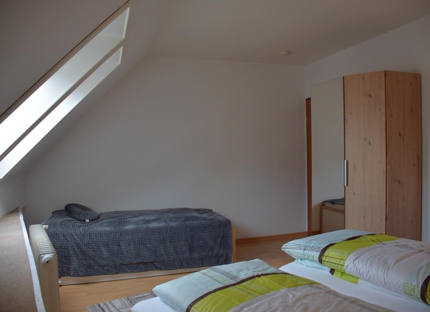 Schlafzimmer mit Zusatzbett