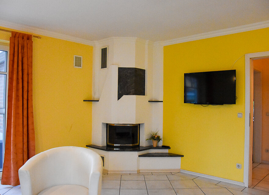 Kamin und Flat-TV